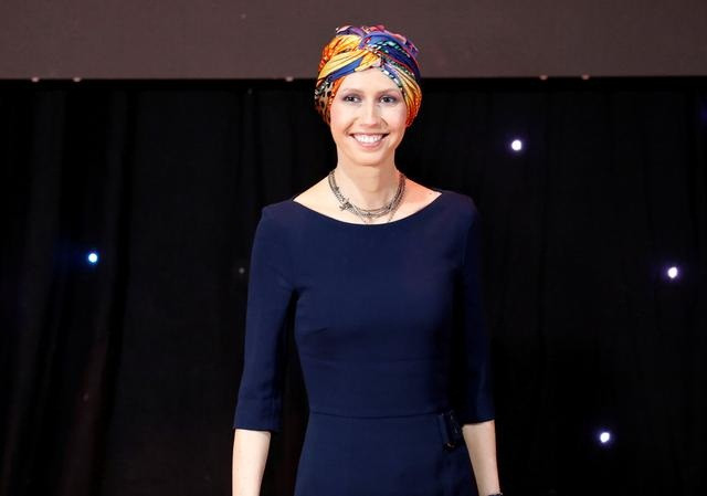 Đệ nhất phu nhân Syria Asma al-Assad sở hữu gương mặt khả ái, có phong cách thời trang sành điệu. Ảnh: Reuters.