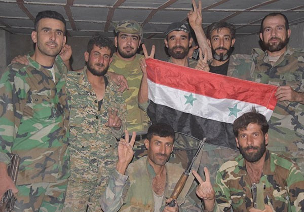 Được biết, các binh sĩ Syria đã tiến vào những khu dân cư ở Ayn Tarma hôm 18/7 và vấp phải sự phản kháng của phiến quân Failaq Al-Rahman. Ảnh: FNA.