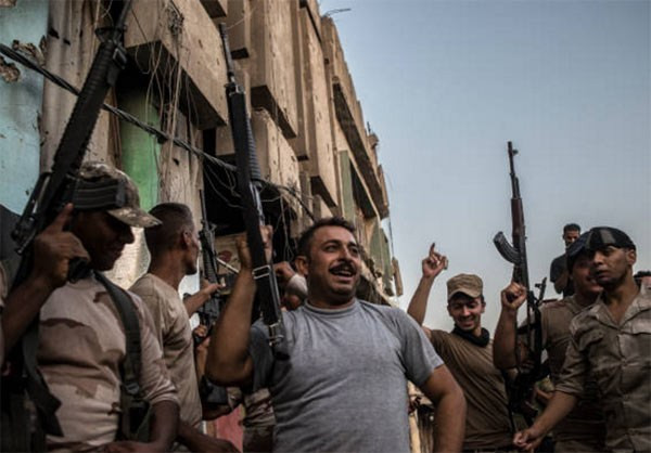 Hình ảnh lực lượng Iraq ăn mừng chiến thắng ở Mosul. Ảnh: FNA.