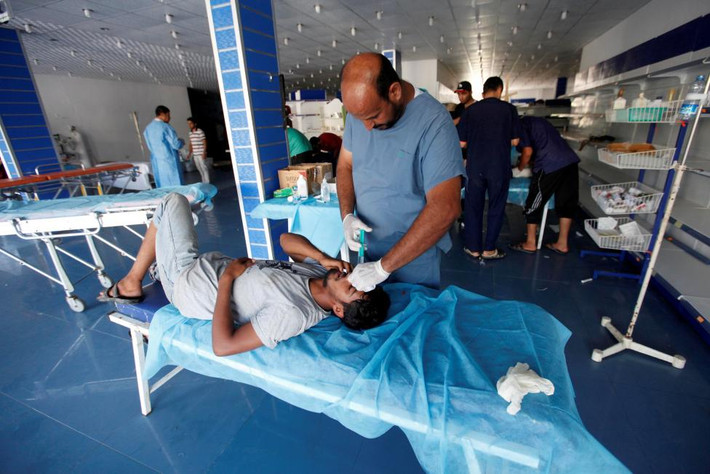 Một chiến binh lực lượng Libya bị thương sau cuộc giao chiến với các chiến binh IS ở Sirte hôm 22/9.