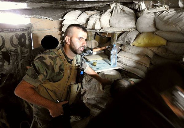 Một binh sĩ Syria trong căn cứ ở Đông Damascus. Ảnh: FNA.