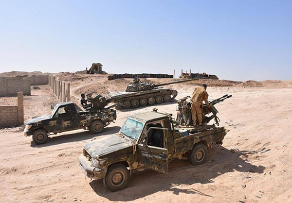 Các binh sĩ Syria trên xe quân sự. Ảnh: FNA.