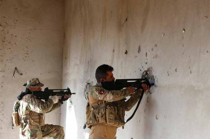 Lực lượng an ninh Iraq trong cuộc giao tranh với phiến quân IS ở thành phố Mosul hôm 30/12.