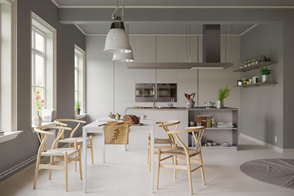 Phòng ăn màu xám này lại được thắp sáng nhờ bộ ghế gỗ Wishbone với những đường cong, một phong cách mang tính biểu tượng của nhà thiết kế đồ nội thất Hans Wegner người Đan Mạch.