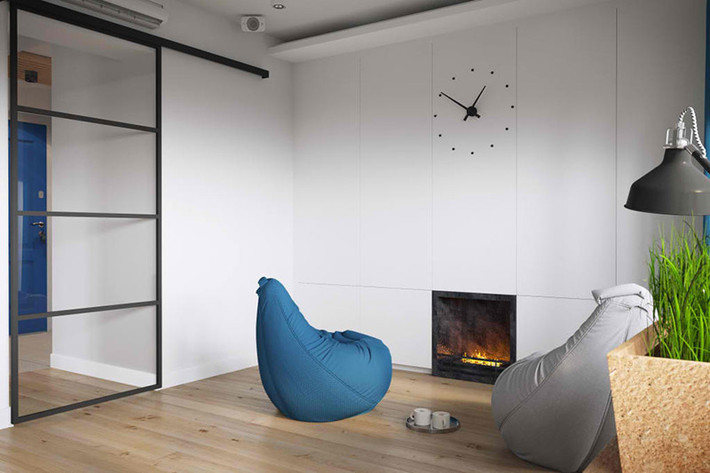Lò sưởi nhỏ cũng được đặt ngay trong phòng khách. Những chiếc ghế “Bean bags” độc đáo, có thể dễ dàng di chuyển cũng là một trong những lựa chọn thông minh.