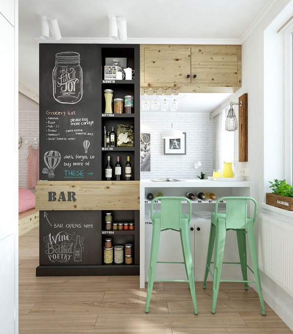 Quầy bar tăng thêm nét thi vị cho cuộc sống hàng ngày, cũng đóng vai trò ngăn chia không gian nấu nướng và tiếp khách trong căn hộ nhỏ.