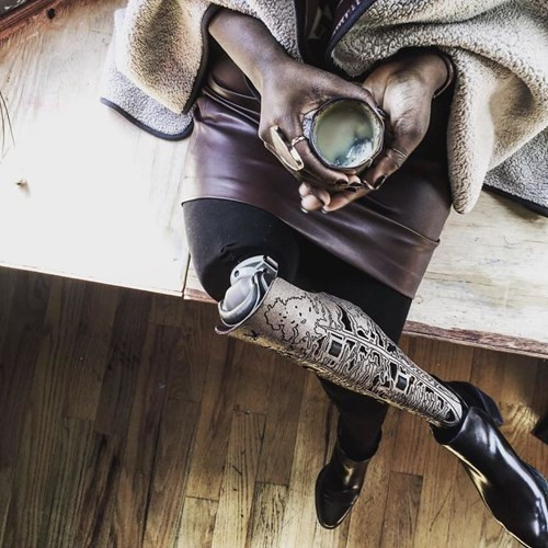Mama Cax (sinh năm 1989 tại Brooklyn, Mỹ) nhưng lại lớn lên ở Montreal và Haiti. Từ năm 14 tuổi, Mama đã bị chẩn đoán mắc bệnh ung thư và không thể sống quá 3 tuần.