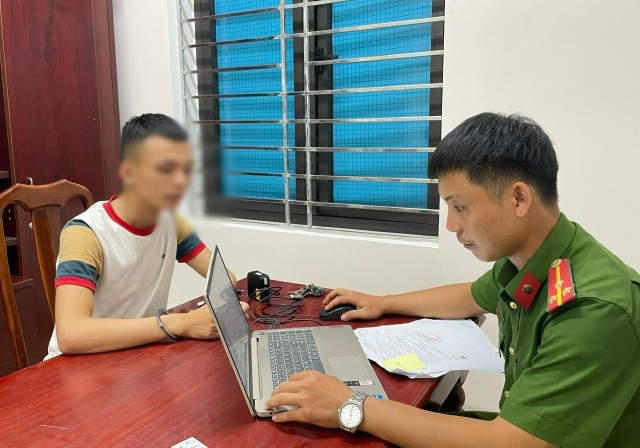 Đối tượng Nguyễn Đăng Hữu tại cơ quan Công an. huu.jpg