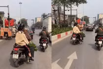 Người phụ nữ thản nhiên bứng hoa giữa phố Hà Nội, netizen đồng loạt dậy sóng