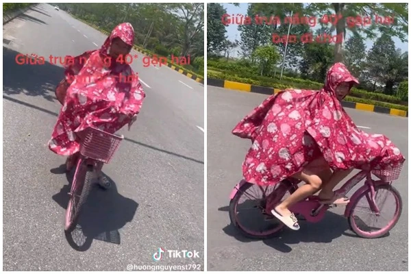 Đôi trẻ mặc áo mưa đi trong "chảo lửa" Hà Nội