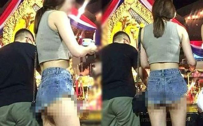 Thay vì những trang phục kín đáo, trang trọng thì cô gái này lại diện chiếc quần ngắn cũn cỡn, rất không phù hợp khi đi lễ chùa. Ảnh: Gia đình & Xã hội.