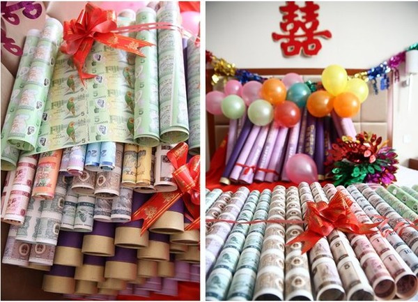 Tặng con gái 99 tấm tiền mới làm của hồi môn: Một đại gia người Trung Quốc khác đã tặng cho con gái của mình 99 bảng tiền mới tinh, có giá trị hàng tỷ đồng làm của hồi môn. Món quà hồi môn này là những tấm tiền mới tinh chưa cắt, được cuộn thành từng ống và thắt nơ, ngoài món quà trên, đại gia này còn tặng một số món quà bất động sản khác.