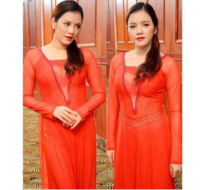 Lý Nhã Kỳ cũng từng gây sóng dư luận với áo dài màu cam, mỏng dính lộ rõ nội y.