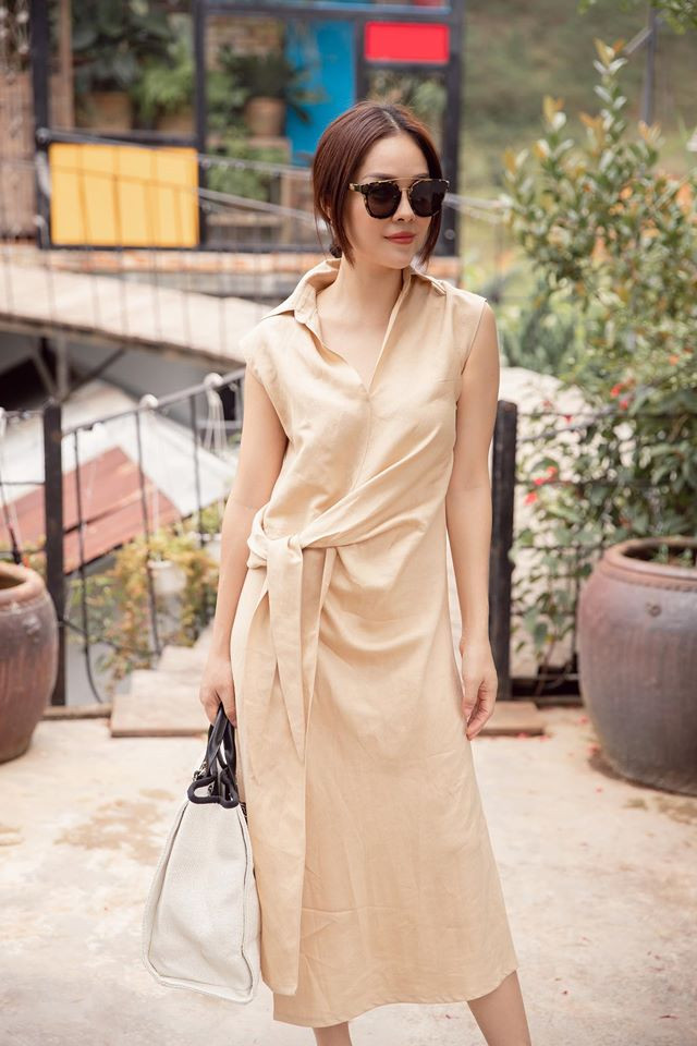 Chiếc váy suông với điểm nhấn ở phần cạnh eo độc đáo tạo nên phong cách thời thượng cho Cẩm Lynh. Ảnh: FBNV.