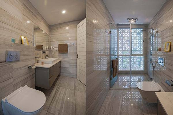 Nhà tắm ốp đá toàn bộ, tạo cảm giác sang trọng và sạch sẽ.
