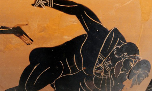 Arrichion là lực sĩ nổi tiếng của Hy Lạp. Ông là nhà vô địch Olympic môn pankration - kết hợp giữa đấm bốc và vật. Tuy nhiên, trong lần tranh tài giành vương miện Olympic lần thứ 3 năm 564 TCN, Arrichion đã bị đối thủ bóp cổ từ phía sau. Không thể thoát khỏi đòn tấn công mạnh của đối thủ, Arrichion tìm cách tóm lấy cổ chân của đối phương và vặn cho đến khi nó gãy. Do quá đau đớn nên đối phương mới chịu bỏ cuộc. Tuy nhiên, điều đáng buồn là khi đó cổ của Arrichion cũng bị thắt chặt vào khiến lực sĩ này qua đời.