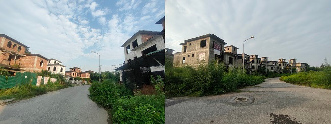 Đường vào khu biệt thự này vắng bóng người ra vào, cỏ mọc um tùm hai bên lối đi.