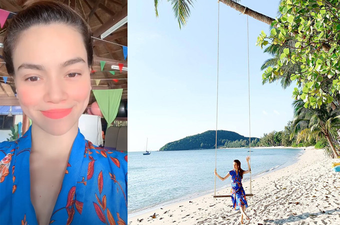 Thời trang du lịch của Hà Hồ mát mẻ với chiếc váy xanh họa tiết nổi bật trên bãi biển ở Thái Lan.