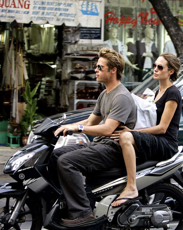 Tháng 11/2006, cặp sao Hollywood ăn mặc giản dị, lái xe máy trên đường phố Sài Gòn, Việt Nam khi họ tới đây để nhận nuôi cậu bé Pax Thien 3 tuổi ở một trại trẻ mồ côi.