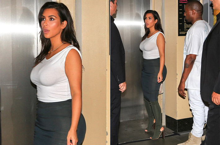 Kim Kardashian cùng chồng Kanye West tới dự sinh nhật lần thứ 32 của em gái Khloe. Ngôi sao truyền hình thực tế mặc chân váy bút chì màu đen ôm sát kết hợp với áo ba lỗ trắng.