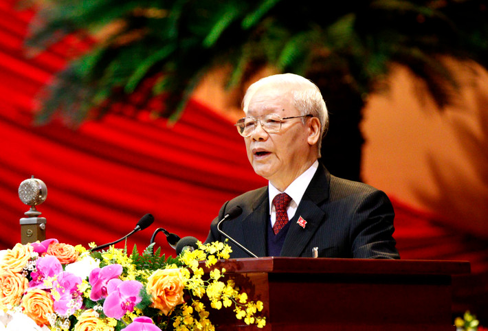 Tổng Bí thư Ban Chấp hành Trung ương Đảng, Chủ tịch nước CHXHCN Việt Nam Nguyễn Phú Trọng đọc Báo cáo chính trị của Ban Chấp hành Trung ương Đảng khóa XII và các văn kiện trình Đại hội
