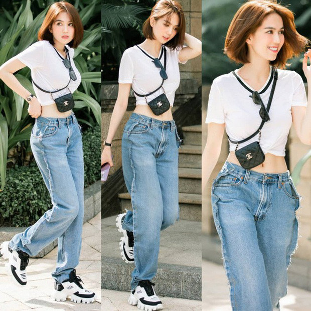 Street style mới nhất của nữ hoàng nội y vẫn là combo quần jeans + crop top khoe eo thon dáng chuẩn. Thiết kế "trước sau như một" khiến Ngọc Trinh từng bị hiểu lầm mặc ngược quần.