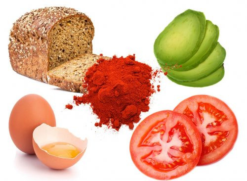 6. Bánh mỳ bơ cay với trứng chiên và cà chua: Thành phần gồm 1 lát bánh mì nướng, ½ trái bơ, 1 quả trứng, 2 lát cà chua, muối và tiêu. Cách làm: Chiên một quả trứng rồi kẹp vào bánh mì nướng. Sau đó thêm vài lát bơ, muối và tiêu. Sau cùng, thêm hai miếng cà chua và thưởng thức. Ảnh: Eatthis.