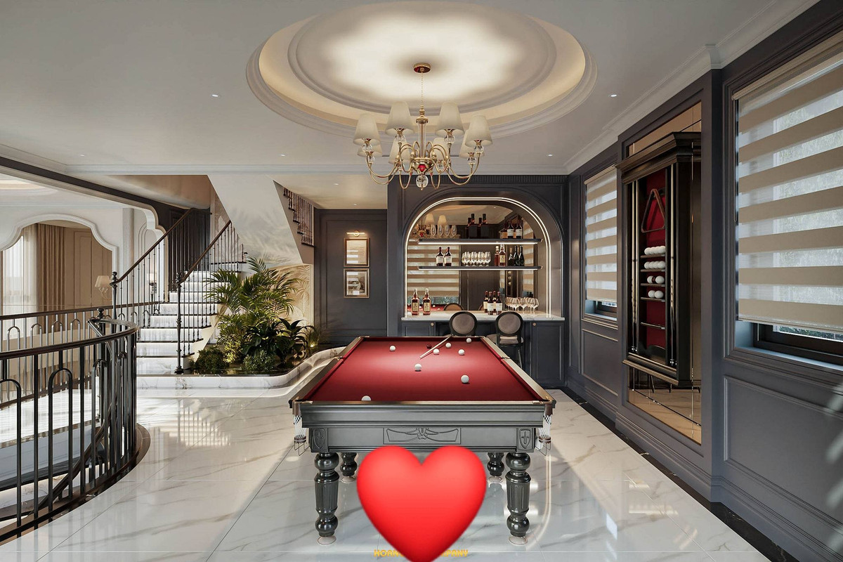 Cạnh đó là quầy bar mini với tủ rượu âm tường thiết kế vòm mềm mại. Ảnh: FBNV