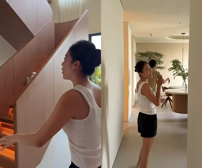 Khu vực cầu thang sử dụng gỗ làm vật liệu chính kết hợp ánh đèn vàng tạo cảm giác ấm cúng. Ảnh chụp màn hình