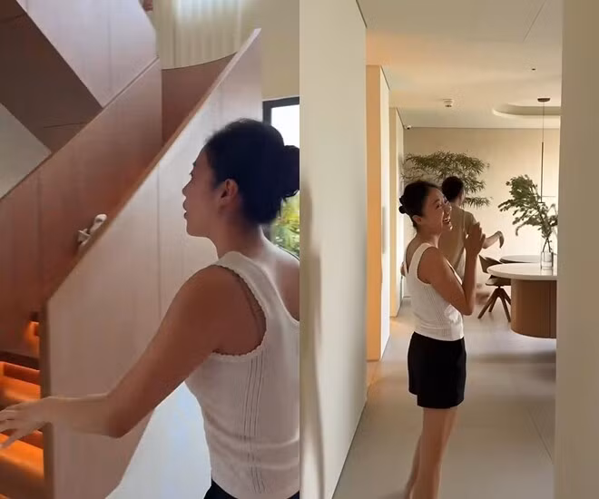 Khu vực cầu thang sử dụng gỗ làm vật liệu chính kết hợp ánh đèn vàng tạo cảm giác ấm cúng. Ảnh chụp màn hình