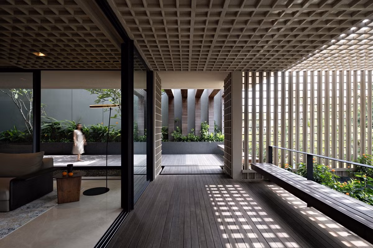 Bao bọc mặt tiền là các khối bê tông dạng sợi và kéo dài trên trần nhà, tạo cảm giác thống nhất giữa bên trong và ngoài. Ảnh: Mario Wibowo