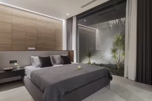 Không gian phòng ngủ cũng kết nối với thiên nhiên. Ảnh: Goku Agency