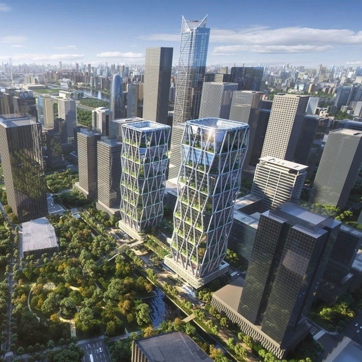 SOM có nhiều dự án hoàn thành trong năm 2026, trong đó nổi bật là cặp tòa nhà chọc trời tại Quảng Châu. Tòa tháp cao nhất trong hai tòa tháp sẽ đạt chiều cao 204 mét. Hai công trình được liên kết bởi hệ cấu trúc lưới chéo lộ thiên và khối đế chung. Ảnh: Dezeen