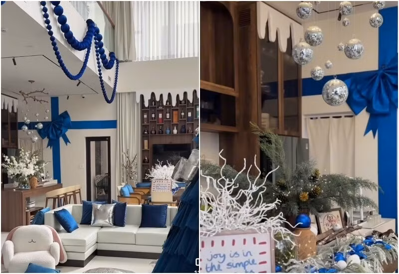 Nữ diễn viên tự cắt xốp để tạo hình tuyết, trèo thang để trang trí đèn chùm, dán nơ lên tường, treo quả châu lấp lánh. Ảnh: FB Vân Trang