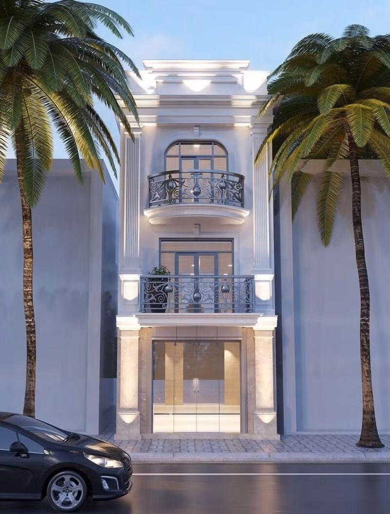 Nhà ống tân cổ điển 3 tầng nổi bật với mặt tiền thiết kế tinh xảo với phào chỉ nhẹ, ban công sắt nghệ thuật và mái vòm cong mềm mại. Ảnh: Duraflex