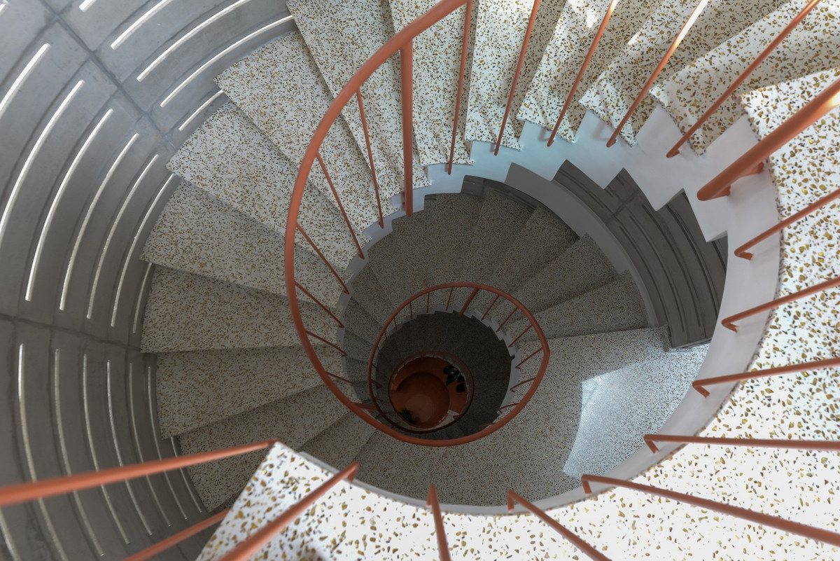 Cầu thang xoắn trở thành điểm nhấn của ngôi nhà. Ảnh: Lon ton studio