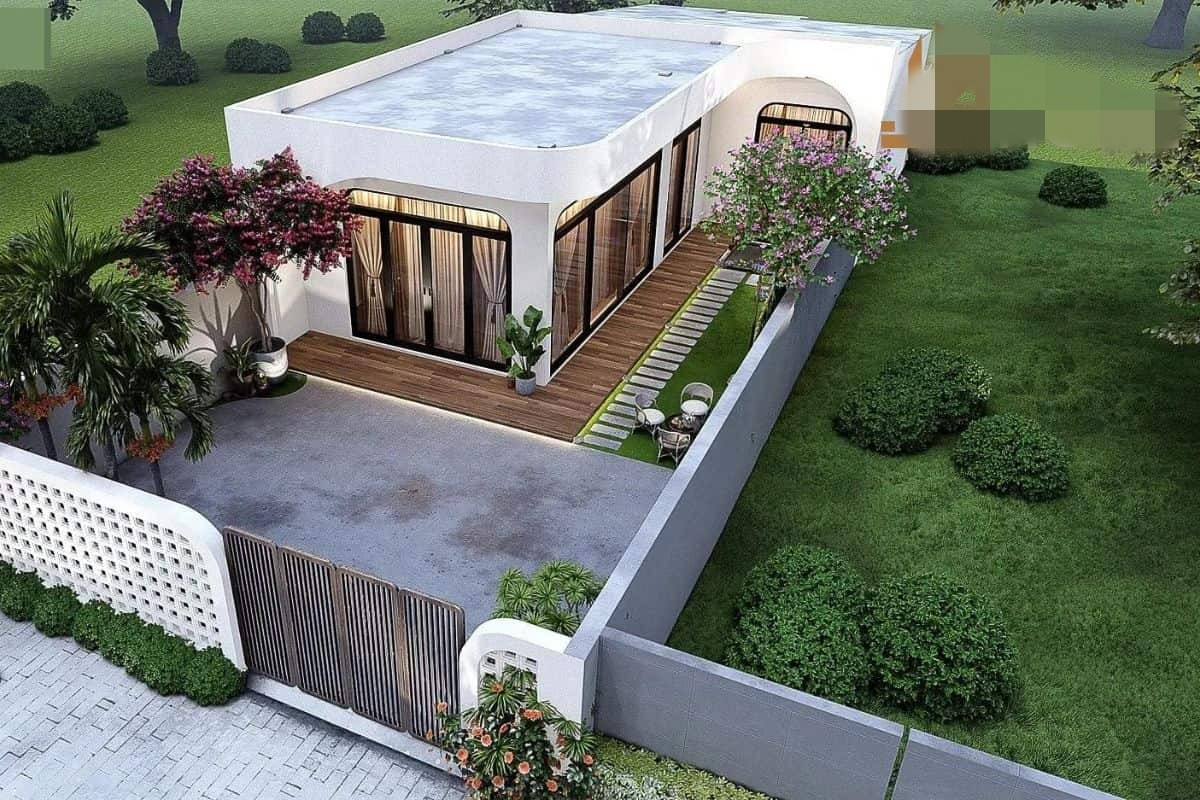 Nhà vườn chữ L thiết kế đơn giản nhưng thoáng đãng, kết nối mạch lạc giữa khu vực sinh hoạt trong nhà và sân vườn. Ảnh: Jamahome