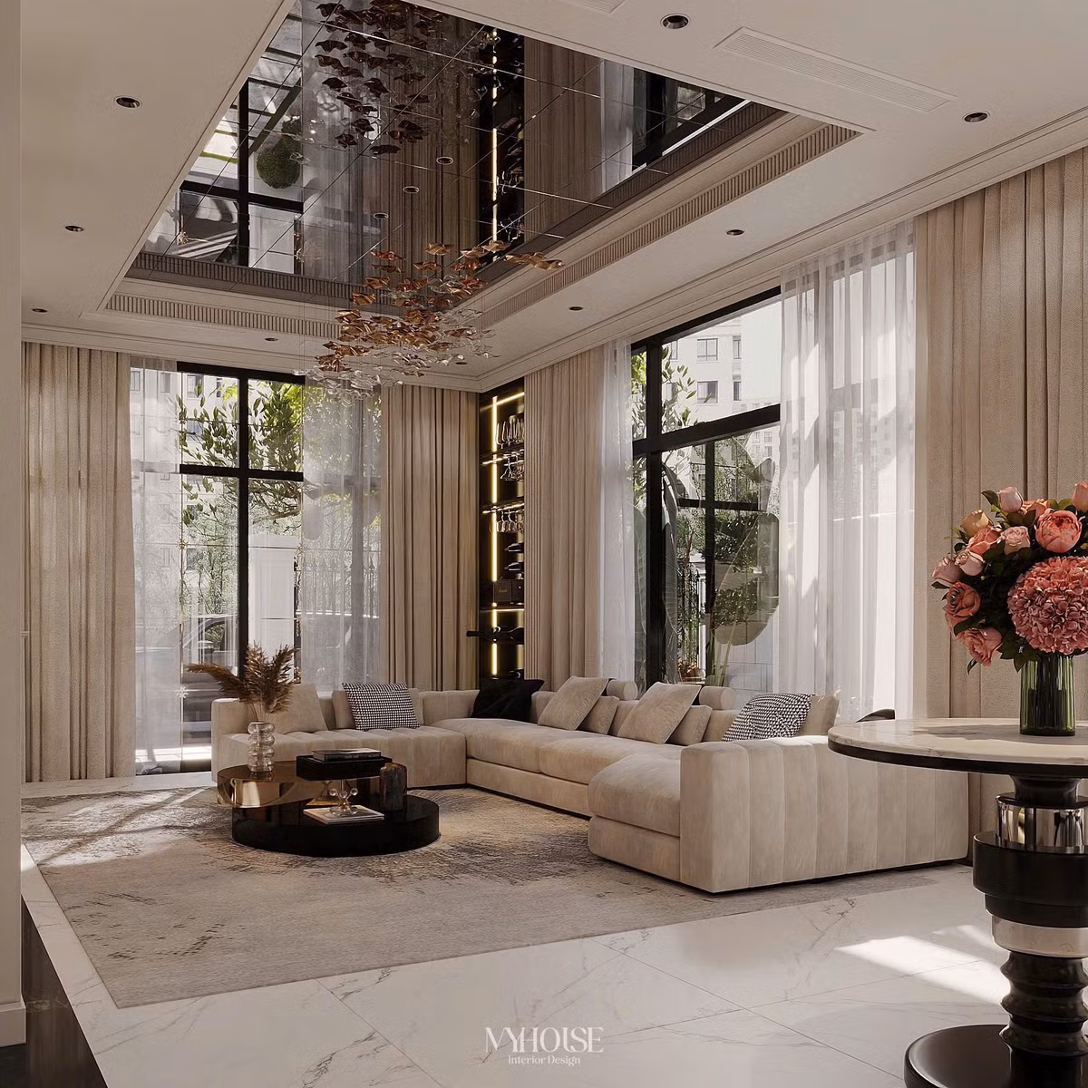 Phòng khách đặt sofa lớn, trần nhà ốp gương tạo hiệu ứng bắt mắt. Ảnh: FBNV