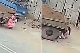 Người phụ nữ mải mê điện thoại, suýt bị xe máy kéo lùi cán chết