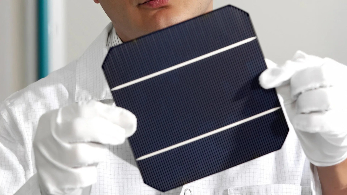 inspecting-new-solar-cell.jpg
