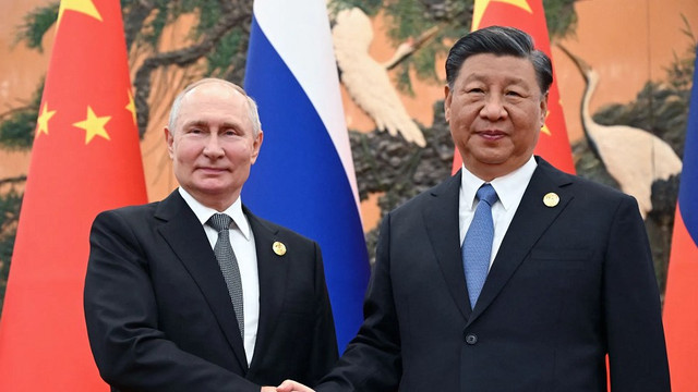 Tổng thống Nga Putin (trái) và Chủ tịch Trung Quốc Tập Cận Bình. Ảnh: Pool. untitled.png