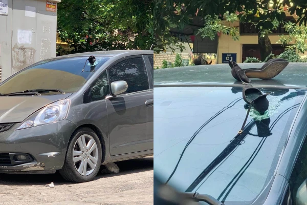 Đỗ xe dưới chung cư, tài xế bị chiếc guốc... úp sọt vỡ kính