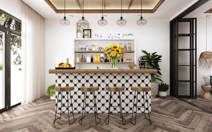 Quầy bar nhỏ trên tầng ba thuận tiện để tổ chức các bữa tiệc ngoài trời trên sân thượng. Khi muốn có một không gian rộng lớn, chiếc cửa kính ngăn đôi quầy bar và phòng đa năng ở bên cạnh sẽ được kéo ra để nối thông hai khu vực, sẵn sàng cho những buổi tiệc lớn tại gia.