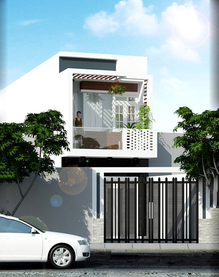Hệ thống cửa kính lớn được kiến trúc sư vận dụng vào thiết kế nhà ống 2 tầng giúp mang lại ánh sáng cho không gian bên trong. Ảnh: Xaydungnhadepmoi.