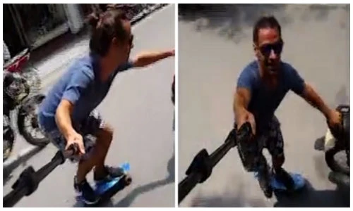 Chàng trai ngoại quốc trượt ván giữa đường phố đông đúc Hà Nội