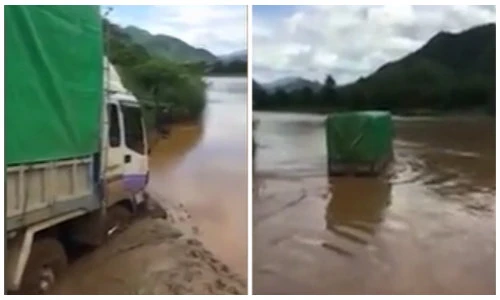 Hãi hùng cảnh tài xế liều lĩnh lái xe tải vượt sông Mã