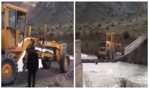 Cảnh máy xúc qua cầu treo tạm gây thót tim