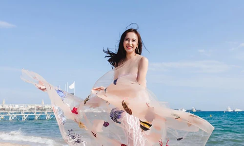 Angela Phương Trinh diện váy Cannes tung tăng dạo biển