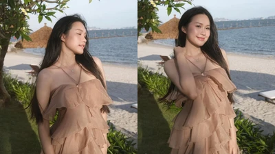 Doãn Hải My đẹp dịu dàng, e ấp khoe vai trần bên bờ biển