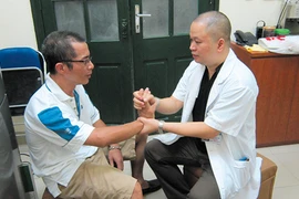 Bệnh nhân Parkinson hết “múa” nhờ phẫu thuật 